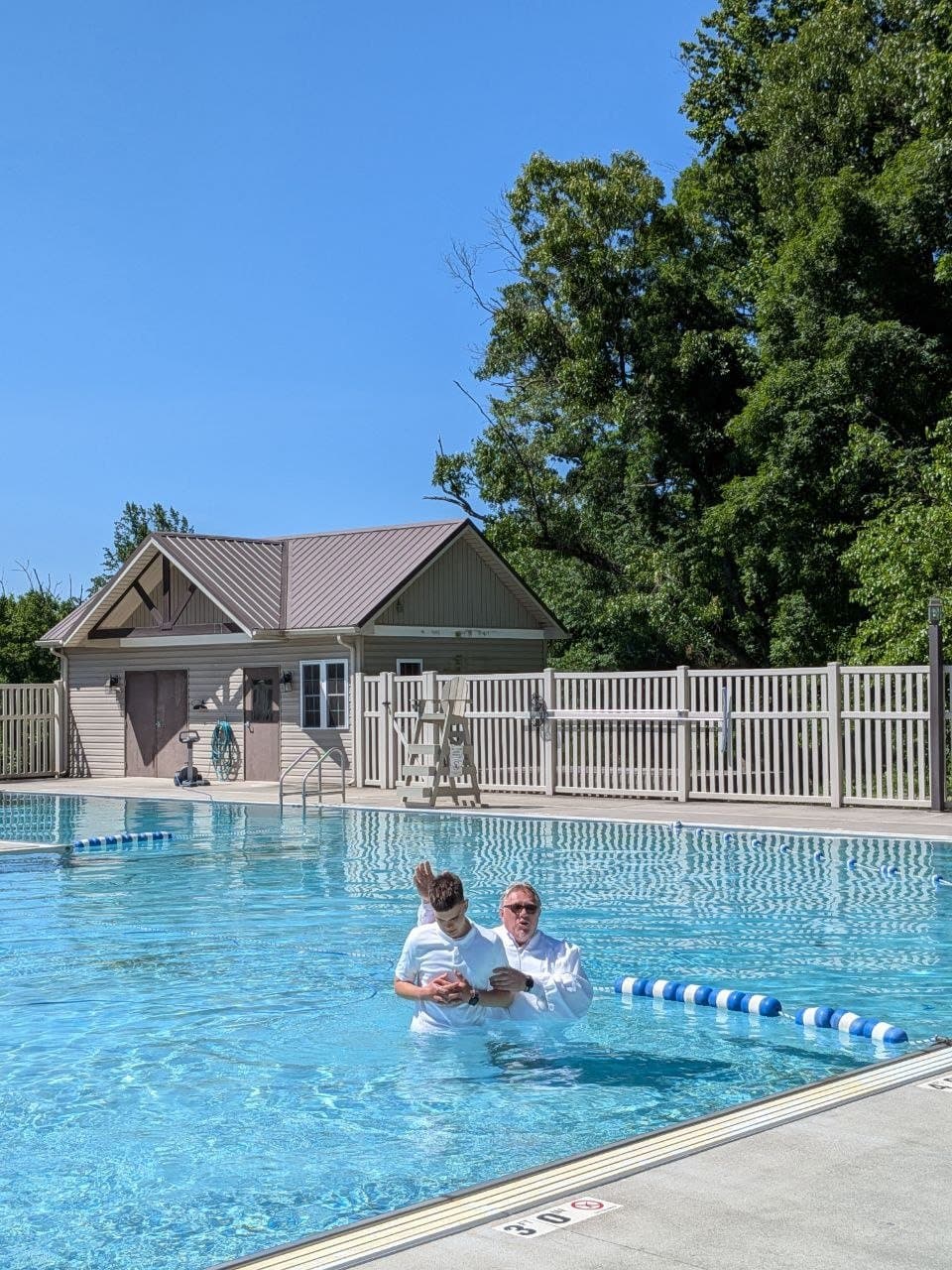 The moment of baptism in the pool