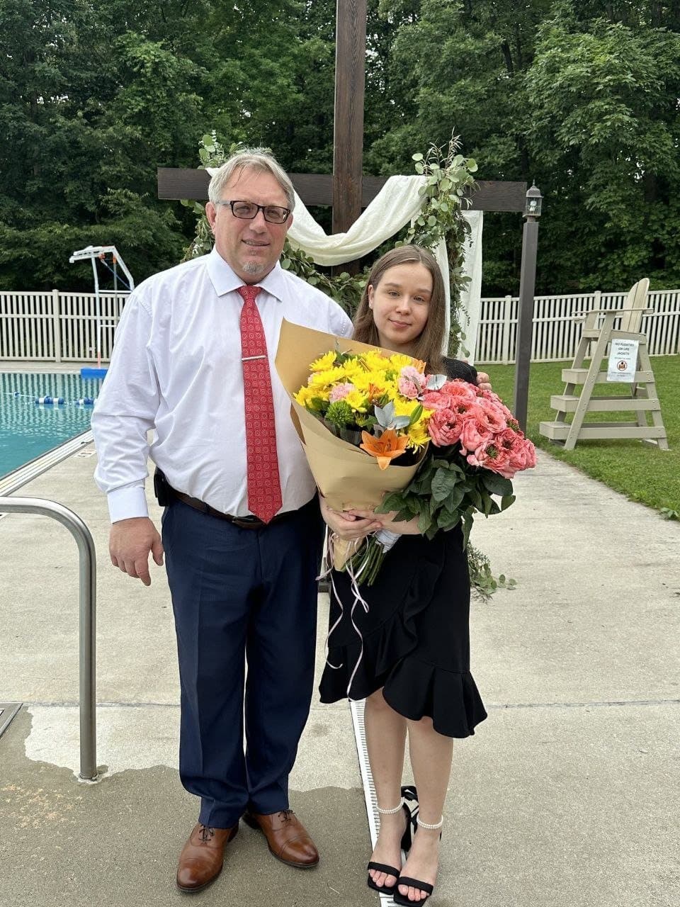 A family with flowers after the baptism